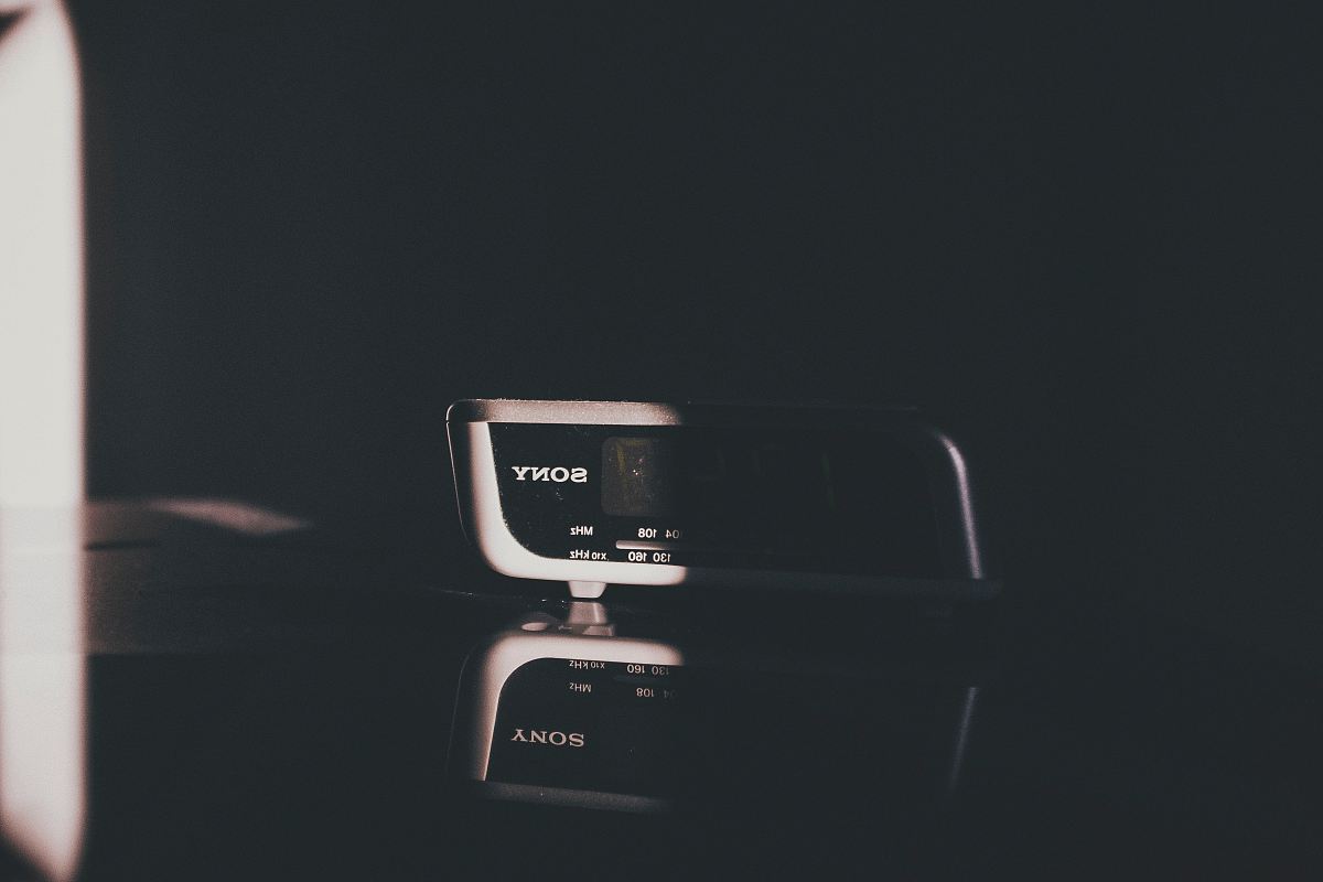 Sony digital alarm clock inside dark room